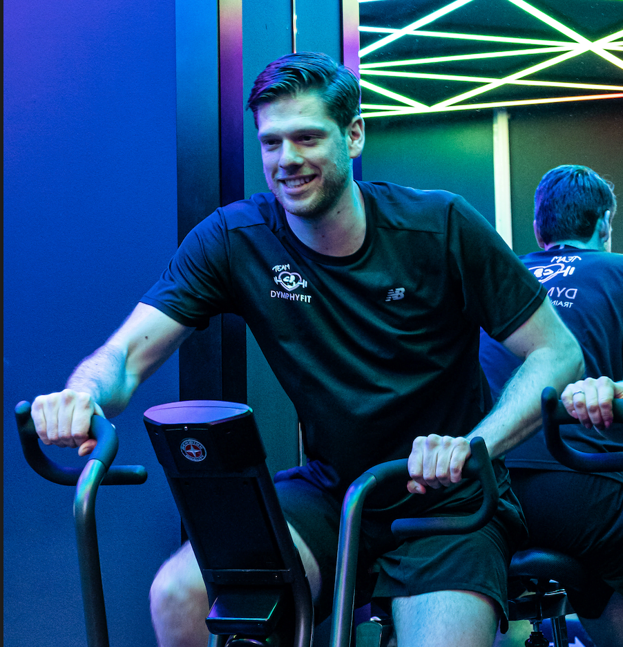 Max on a bike, doing Conditioning training in disco lights.